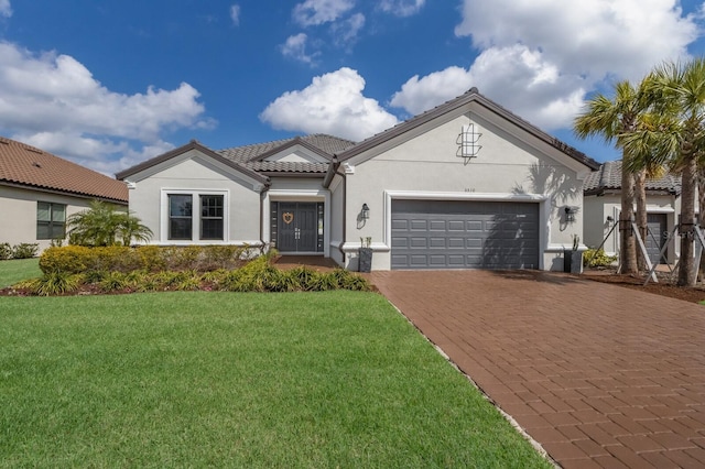 view of front facade with a garage and a front yard