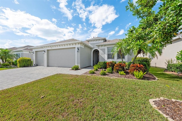 mediterranean / spanish-style house featuring a garage and a front lawn