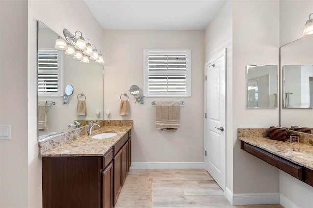 bathroom featuring wood-type flooring and vanity