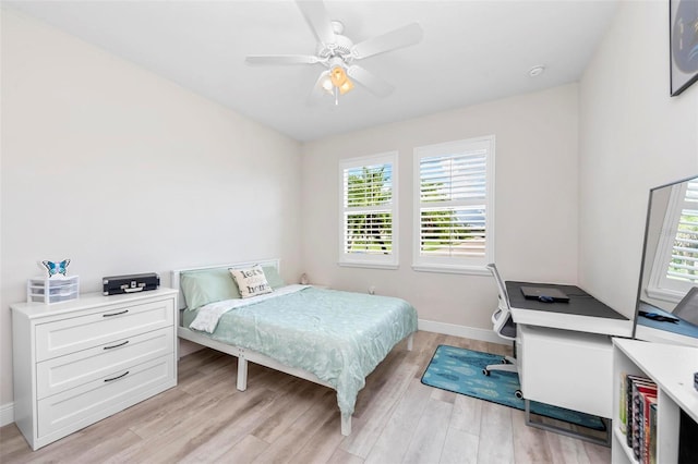 bedroom featuring light wood-type flooring and ceiling fan