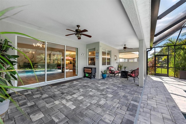 view of patio / terrace featuring a lanai and ceiling fan