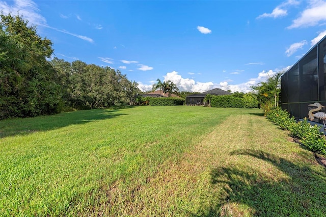 view of yard with a lanai