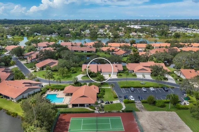 birds eye view of property with a water view