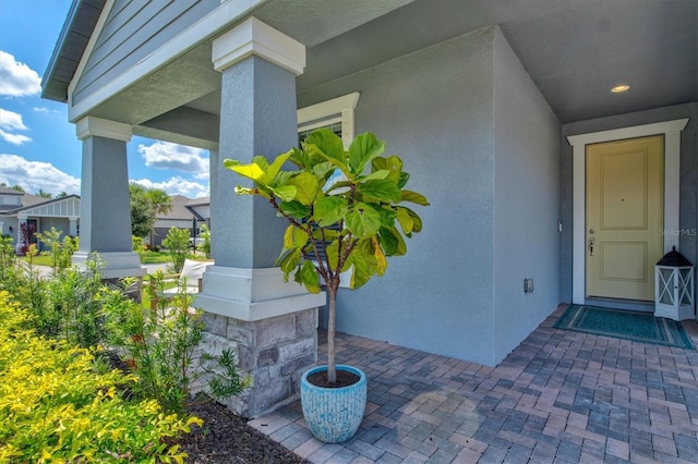 property entrance featuring covered porch