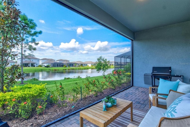 balcony with a water view and a patio area