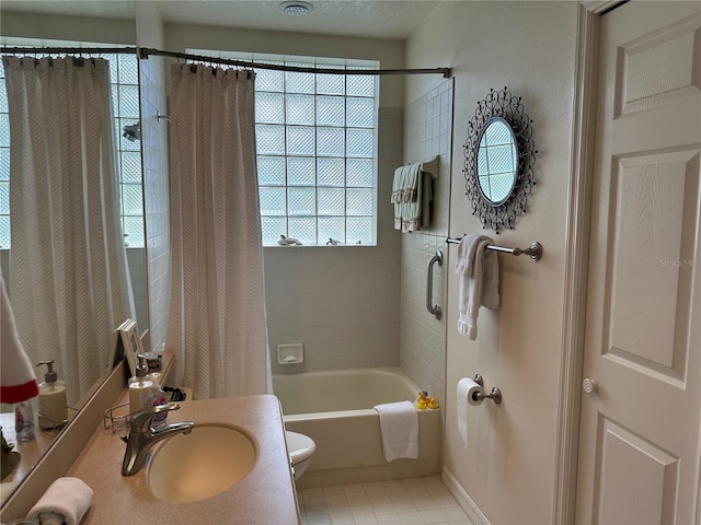 full bathroom with vanity, tile patterned flooring, toilet, and shower / bathtub combination with curtain