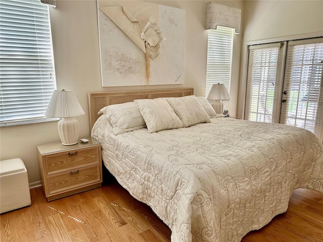 bedroom featuring light hardwood / wood-style flooring and access to exterior