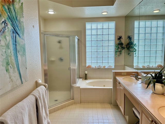 5658 Downham Mdws, Sarasota, FL 34235 - full bath featuring a sink, tile patterned floors, a tub with jets, and a stall shower