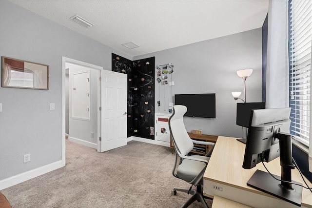 office area featuring a healthy amount of sunlight and light carpet