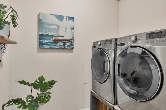 washroom with washer and clothes dryer