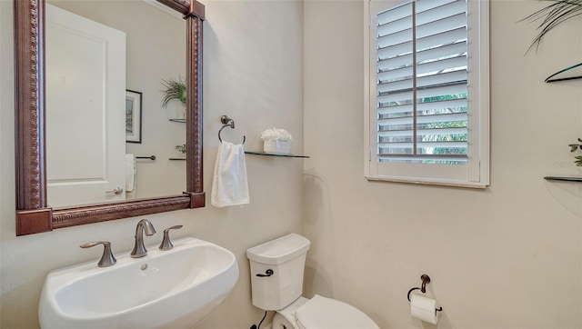 bathroom with toilet and sink