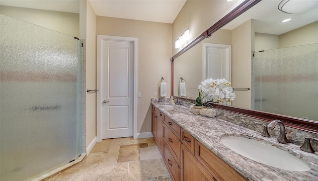 bathroom featuring walk in shower and vanity