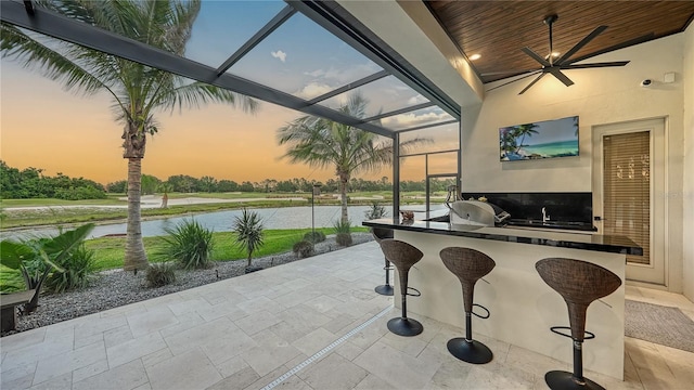 view of patio with a lanai and ceiling fan