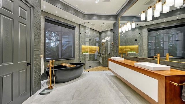 bathroom featuring vanity, shower with separate bathtub, and tile walls