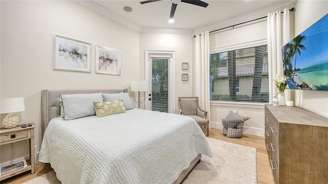 bedroom featuring ornamental molding, ceiling fan, and light hardwood / wood-style flooring