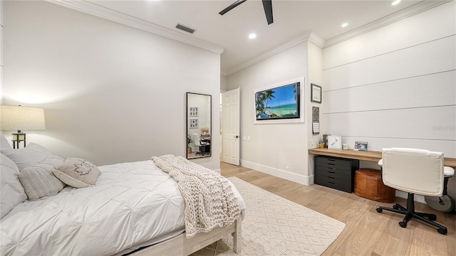 bedroom featuring crown molding, light hardwood / wood-style floors, and ceiling fan