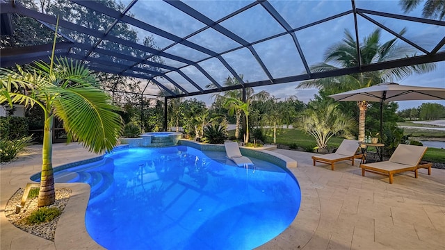 view of swimming pool featuring a lanai, an in ground hot tub, and a patio area