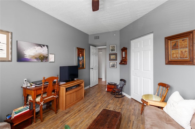 home office with wood-type flooring, a textured ceiling, and ceiling fan