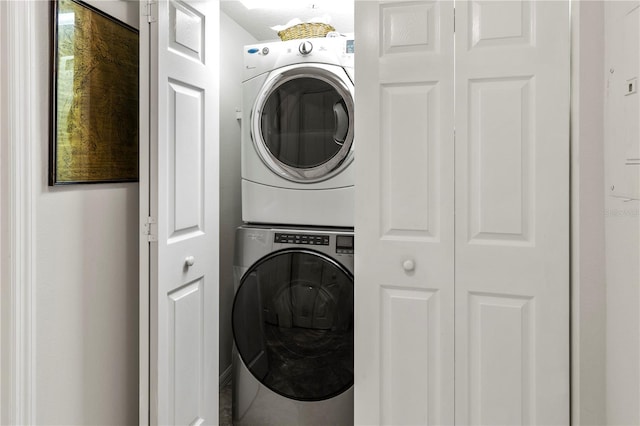 laundry room with stacked washer and clothes dryer