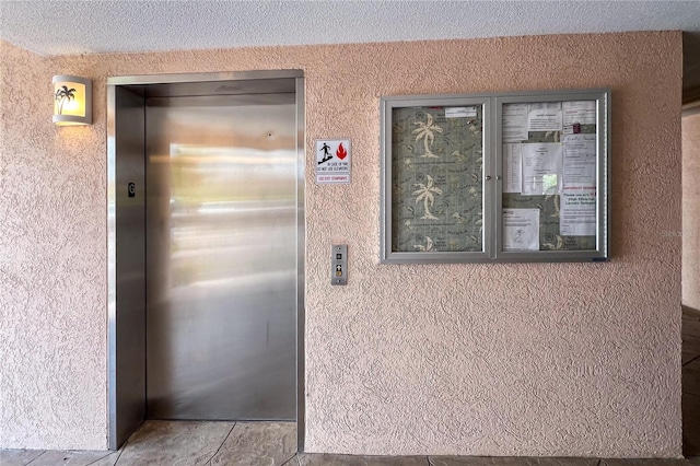 details with tile patterned flooring and elevator