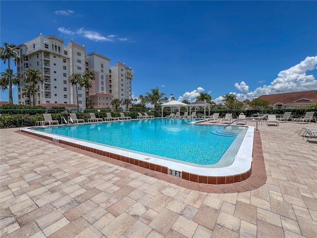 view of swimming pool featuring a patio area