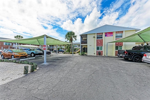 view of partially covered parking lot