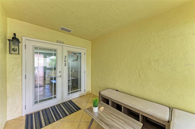 exterior space with visible vents and french doors