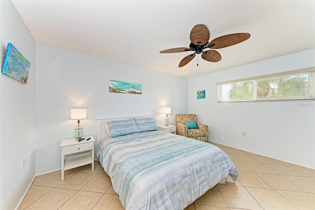 tiled bedroom with ceiling fan