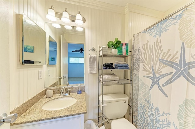 bathroom featuring ornamental molding, a shower with shower curtain, vanity, and toilet