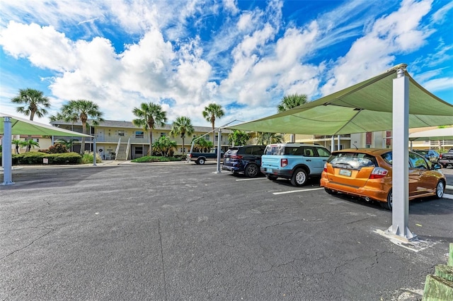 view of partially covered parking lot
