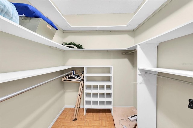 walk in closet featuring light parquet floors