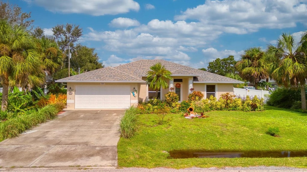 ranch-style home with a garage and a front yard