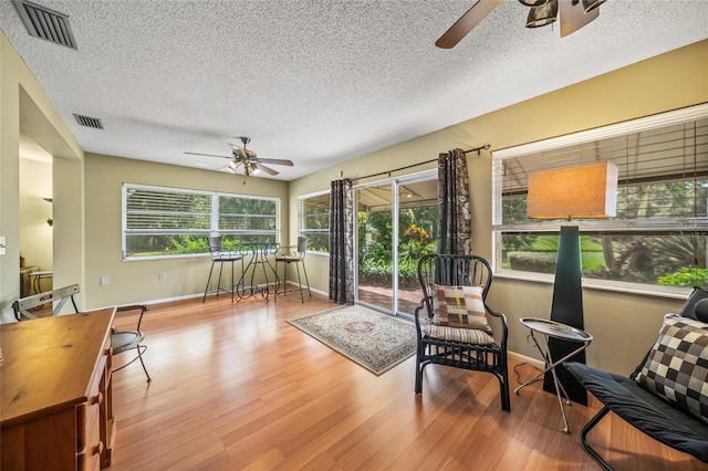 sunroom / solarium with ceiling fan