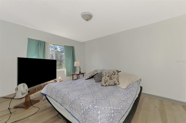 bedroom with light wood-type flooring