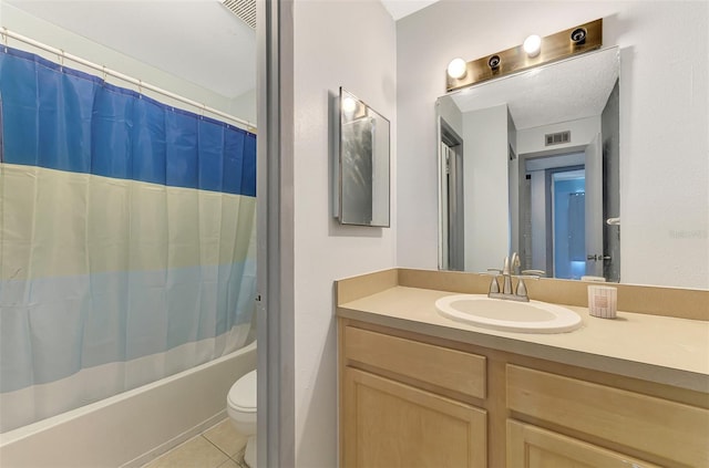 full bathroom with vanity, toilet, shower / bathtub combination with curtain, and tile patterned floors