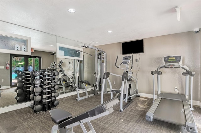 gym featuring dark colored carpet