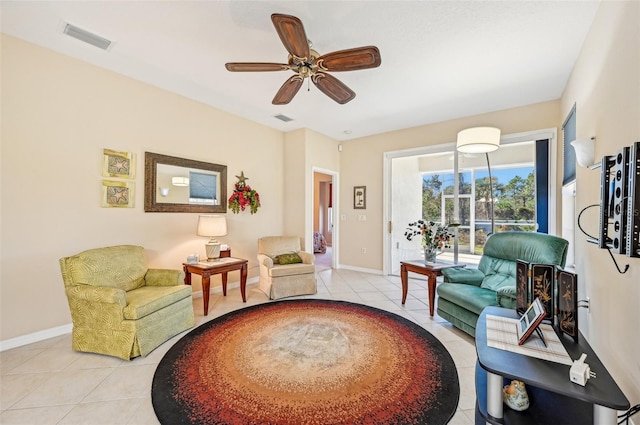 living area featuring ceiling fan and light tile patterned floors