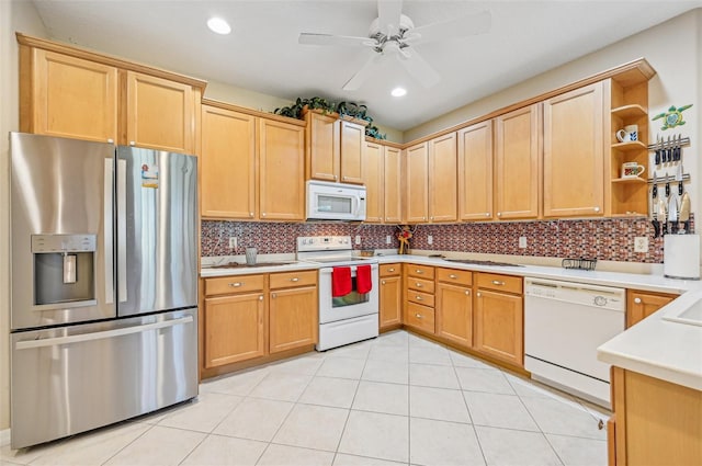 kitchen featuring white appliances, ceiling fan, light tile patterned floors, and tasteful backsplash