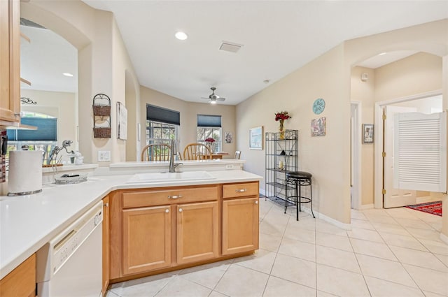 kitchen featuring dishwasher, kitchen peninsula, sink, light tile patterned floors, and ceiling fan