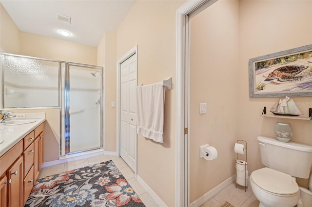 bathroom with toilet, vanity, an enclosed shower, and tile patterned flooring