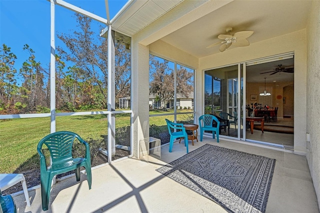 sunroom / solarium with ceiling fan