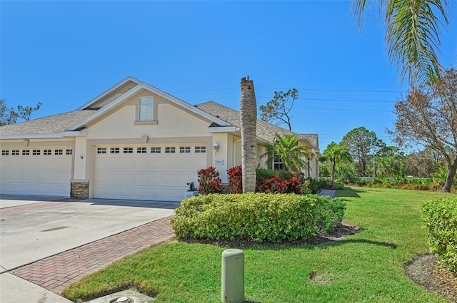 single story home with a front lawn and a garage