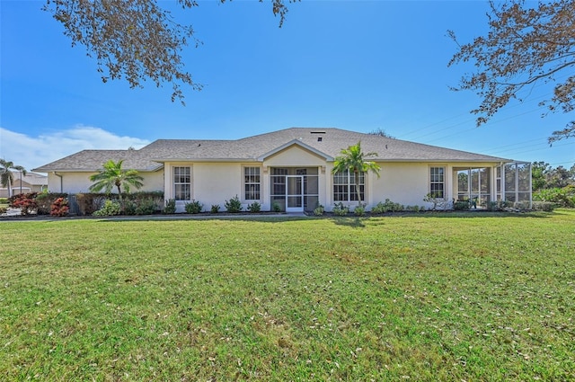 ranch-style home with a front lawn and a sunroom