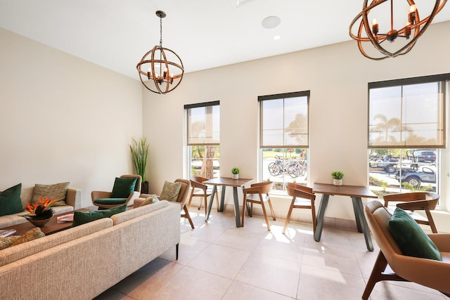 living room featuring light tile patterned floors and a notable chandelier