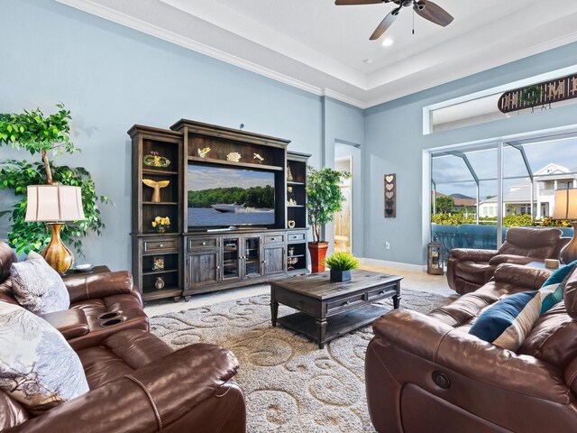 living room featuring ceiling fan and ornamental molding