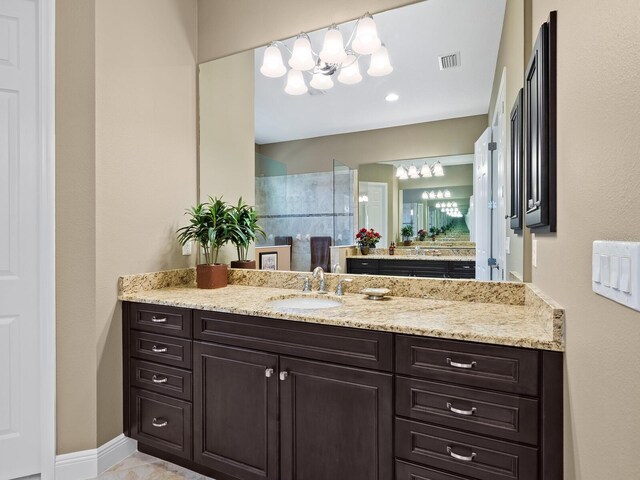 bathroom featuring a shower and vanity