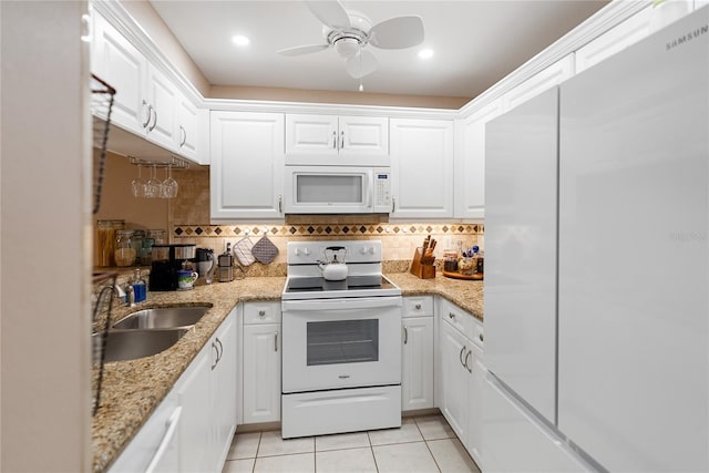 kitchen with white cabinetry, sink, ceiling fan, white appliances, and light tile patterned floors