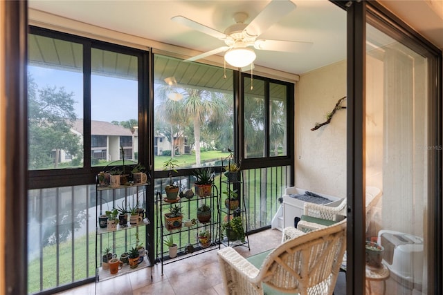 sunroom featuring plenty of natural light and ceiling fan