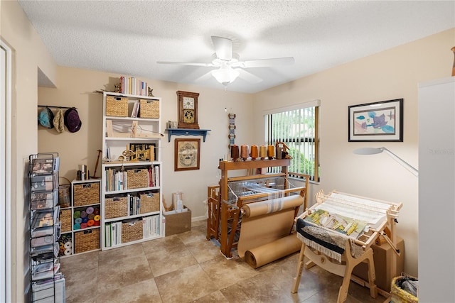 office space with ceiling fan and a textured ceiling