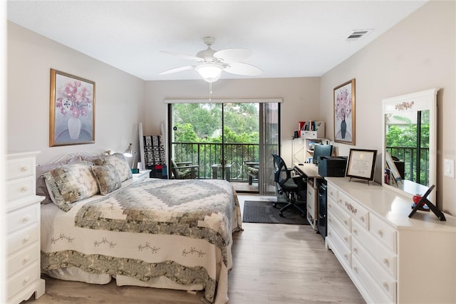 bedroom featuring access to outside, light hardwood / wood-style flooring, and ceiling fan